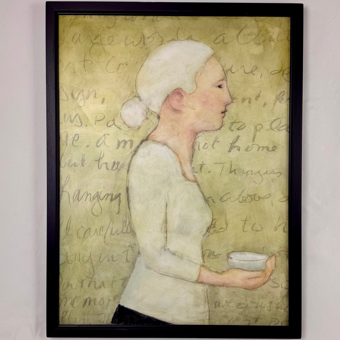 Woman Holding Bowl  with Writing on Wall